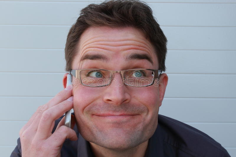 funny-looking-man-telephone-call-happy-glasses-smiling-answering-phone-68838845.jpg