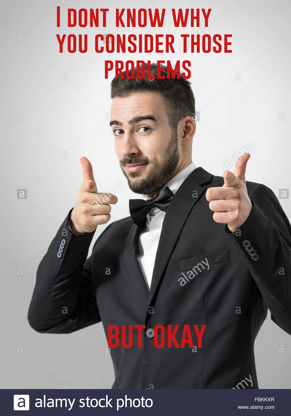 young-cheerful-bearded-man-pointing-finger-gun-gesture-at-camera-desaturated-FBKKXR.png