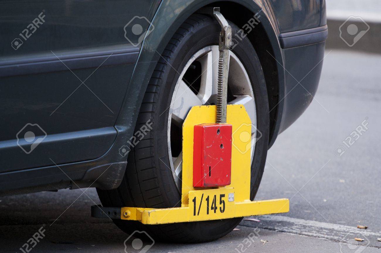 11091855-Wheel-clamp-car-immobilizer-Stock-Photo.jpg