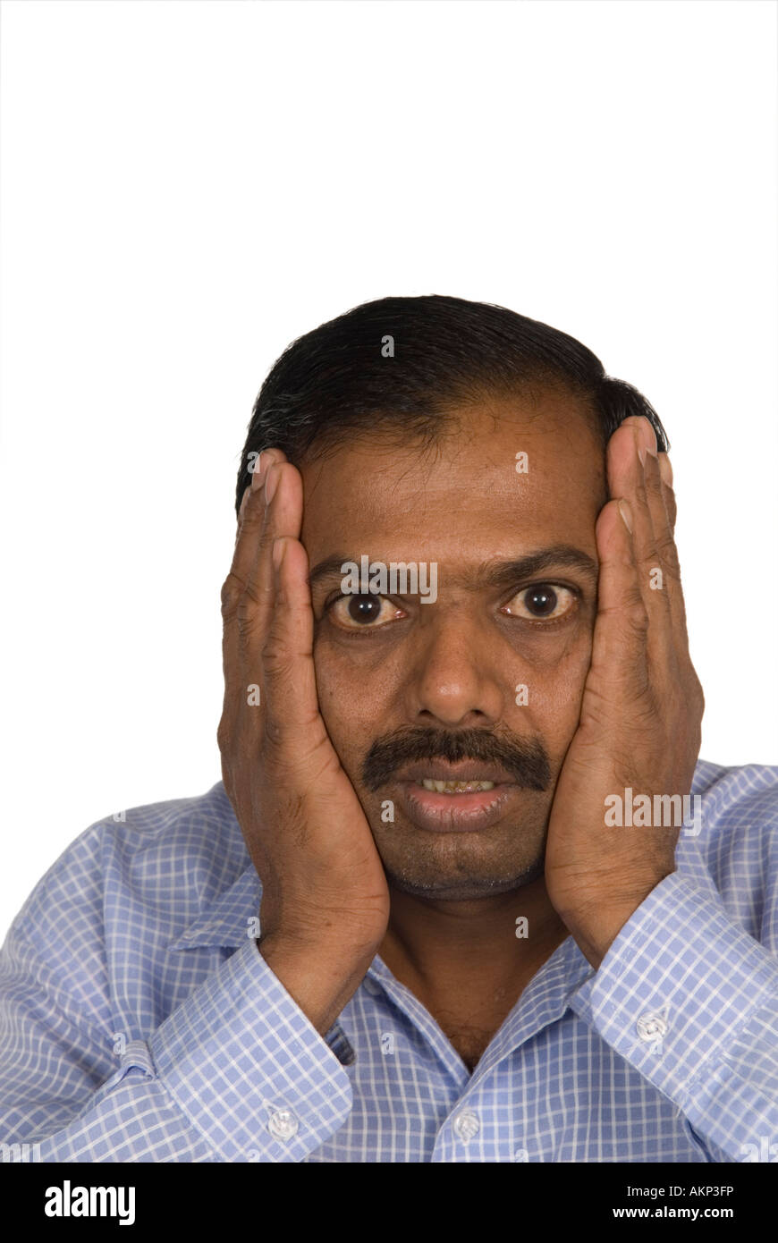 shocked-mature-indian-man-hands-on-head-AKP3FP.jpg