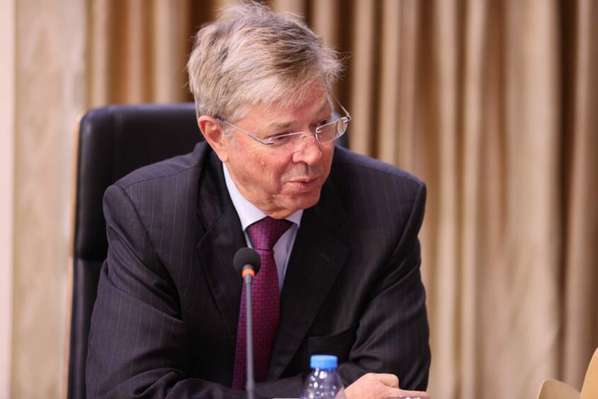 Man in suit with glasses 